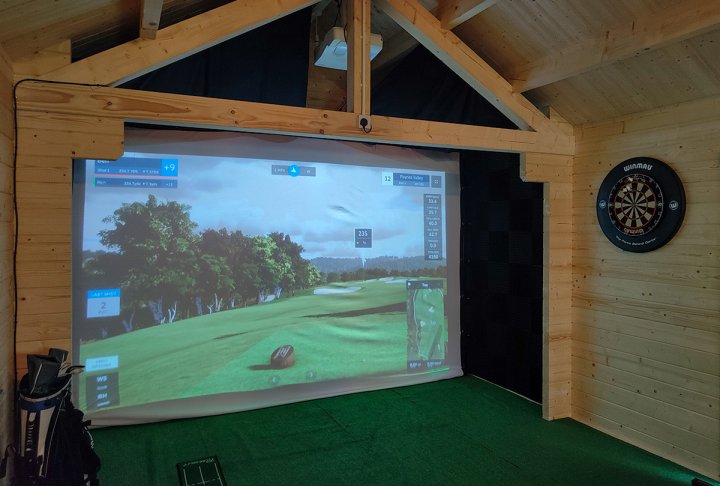 inside a garden building that is being used as a man cave