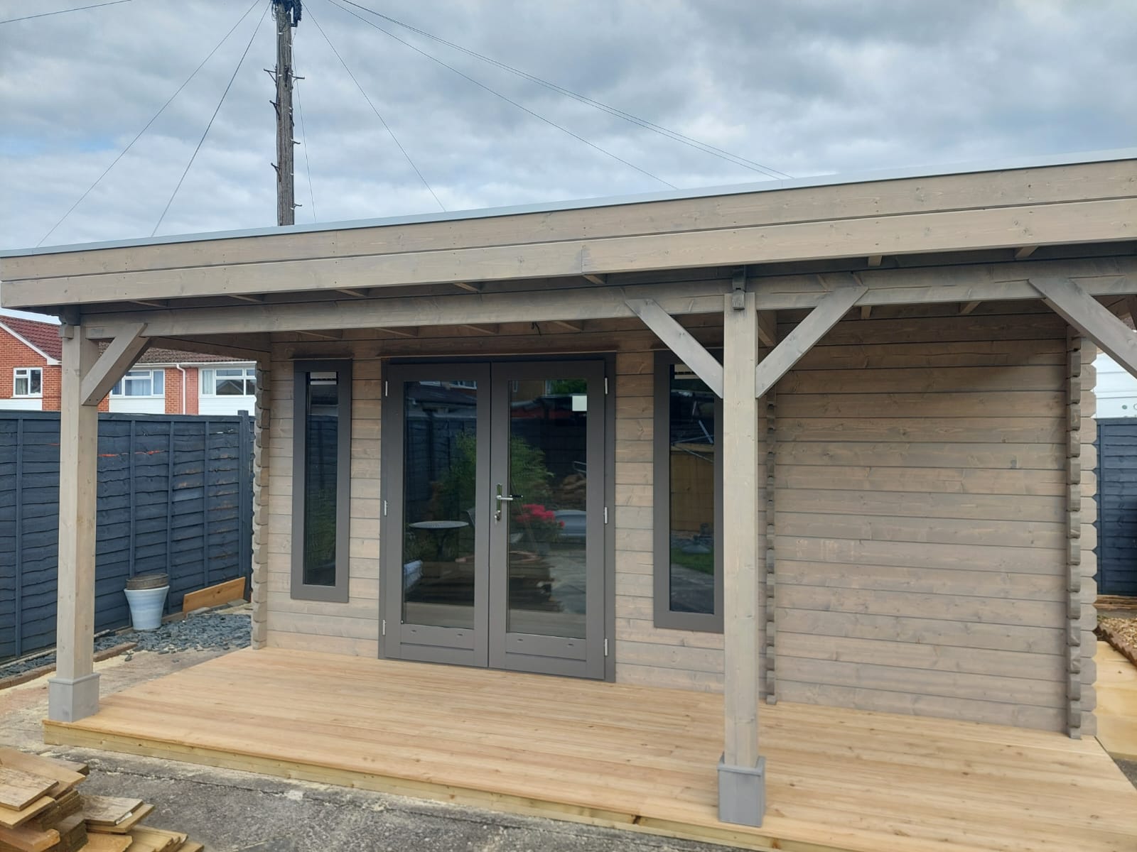 Flat Roof Log Cabin with Canopy - A Timber Log Cabin